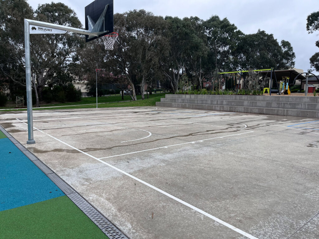 Basketball court with trees background