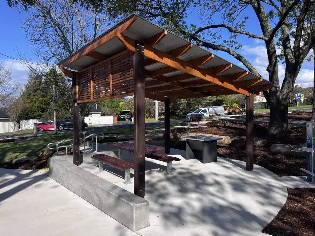 Wooden picnic shelter with seating