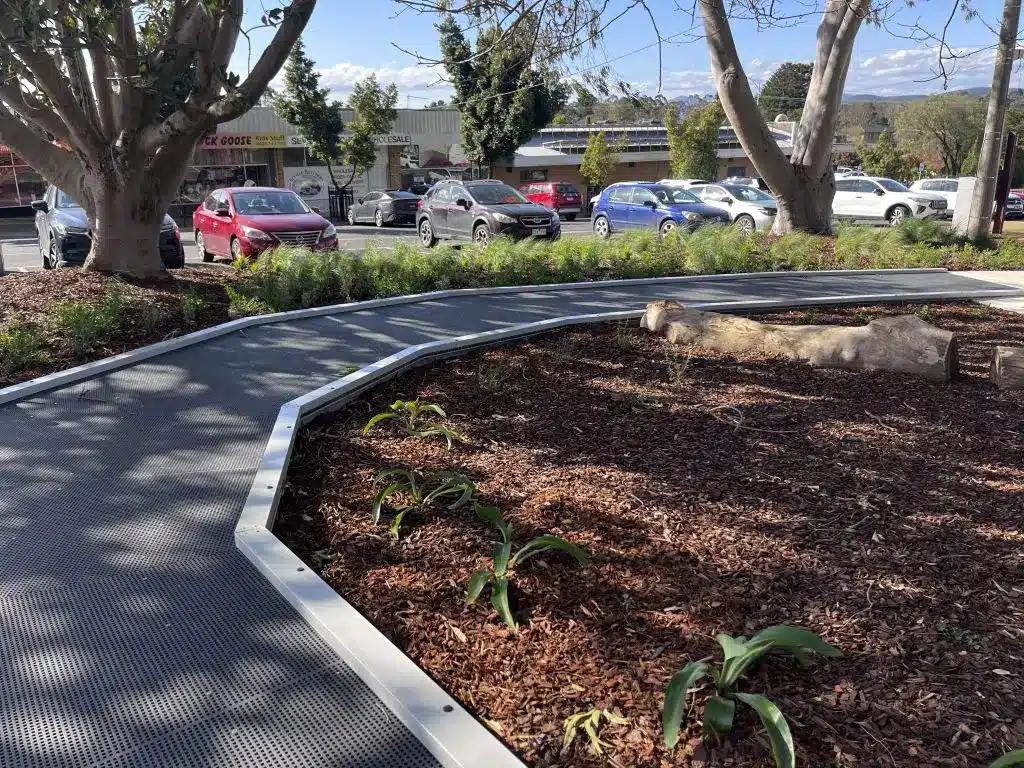 Park pathway with cars