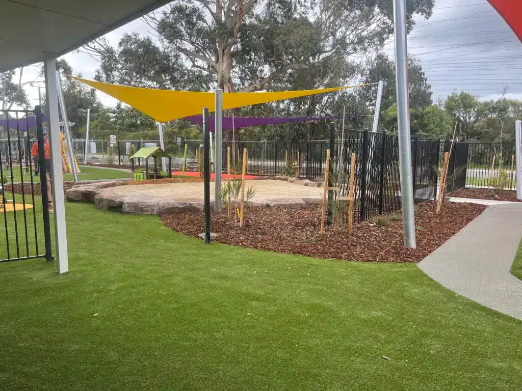 Outdoor play area with sandpit